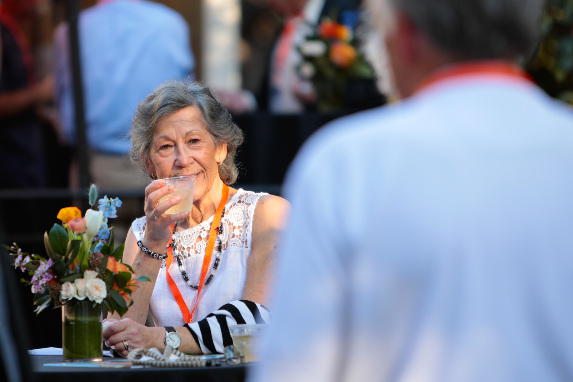 Alumni being photographed while looking into the distance during Alumni Weekend and Reunions.