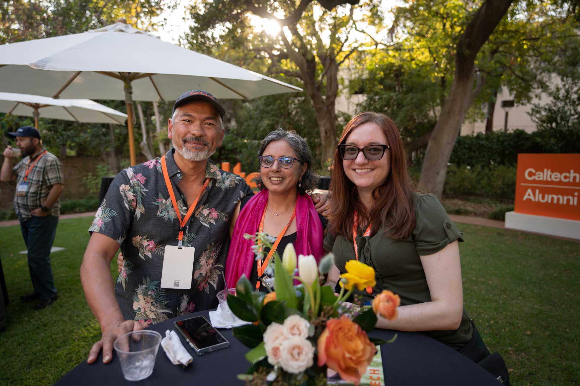 Three alumni smiling for photo during Alumni Weekend and Reunions.