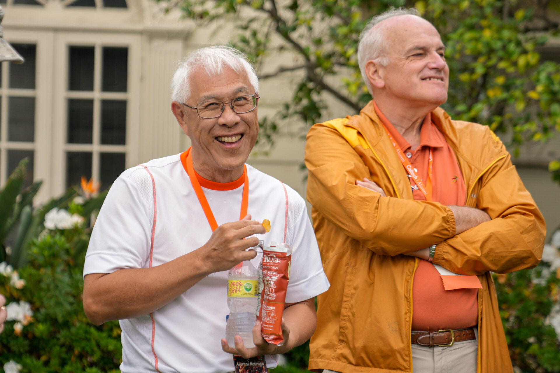 Two alumni being photographed during Alumni Weekend and Reunions.